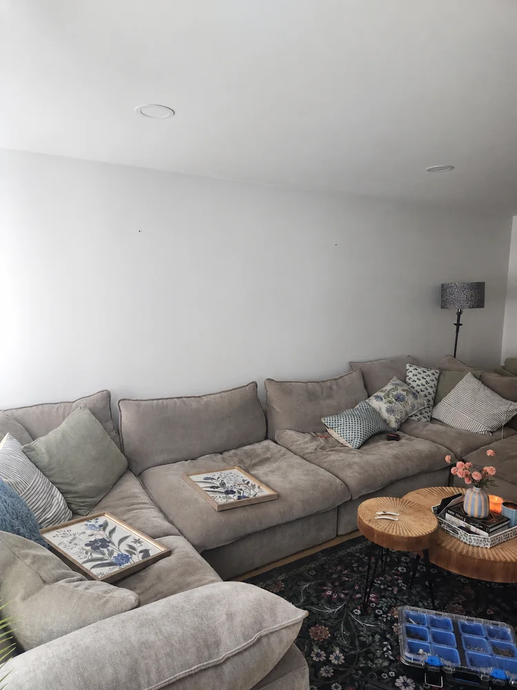 Living room wall before framed artwork was arranged